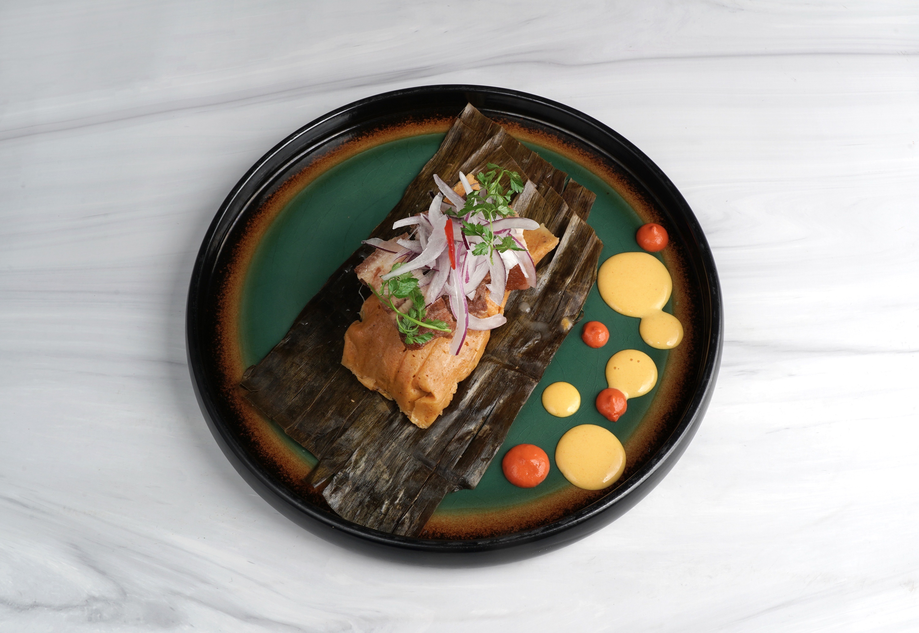 Tamal mit Chicharrón